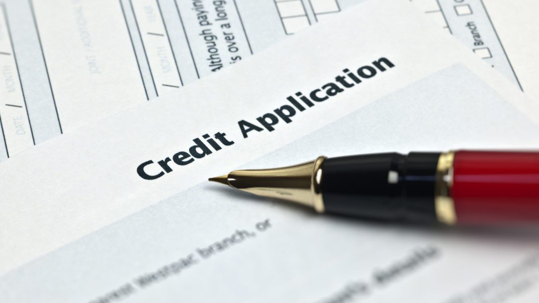 Credit Application - pen lying on credit application